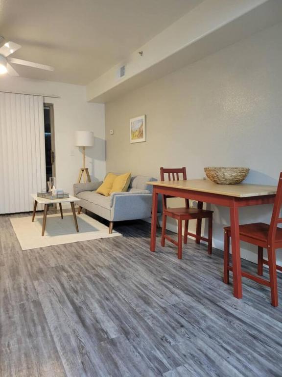 a living room with a table and a couch at Close to ASU campus in Tempe