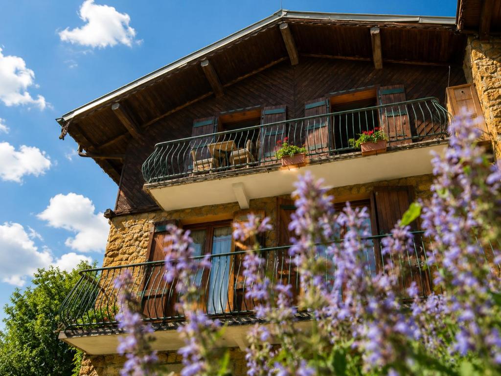 a building with purple flowers in front of it at Chalet Génépi in Montriond