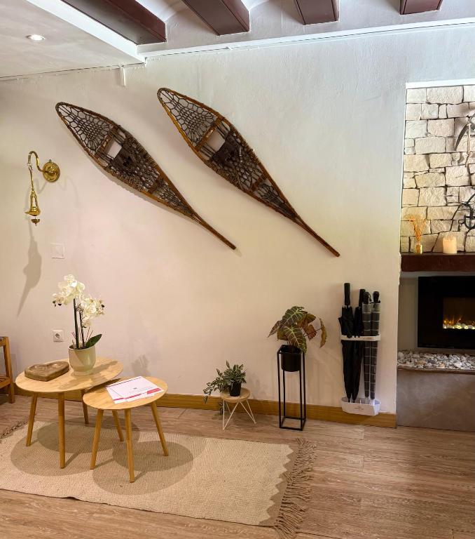 two kayaks hanging on a wall in a living room at APARTAHOTEL CANFRANC in Canfranc