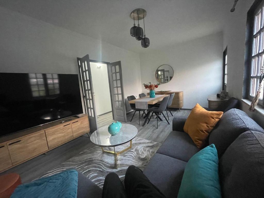 a living room with a couch and a table at Maison Casa Nord du Portugal Gères in Arcos de Valdevez