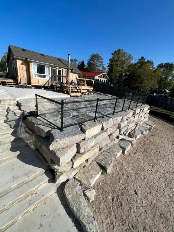 a set of stone steps in front of a house at Riverside Haven on Georgian Bay in Wasaga Beach