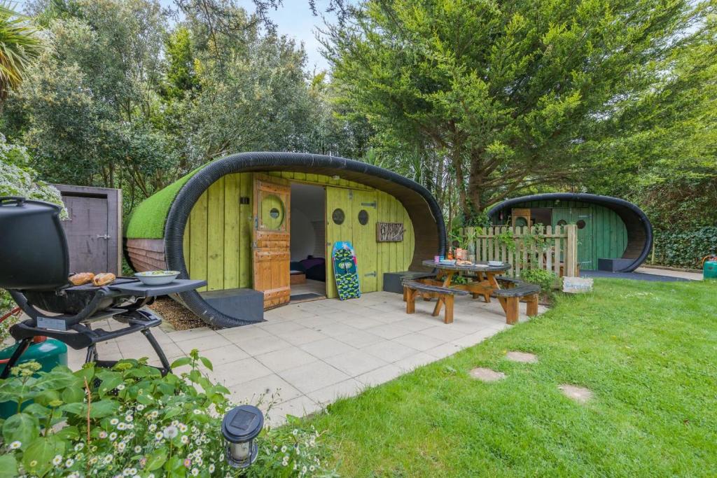 a backyard with a gazebo and a patio at 1 Bed in Bude oc-s34856 in Bude
