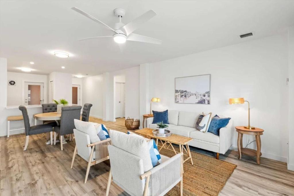 a living room with a couch and a table at Bright 2BR Oceanview Condo in Key West