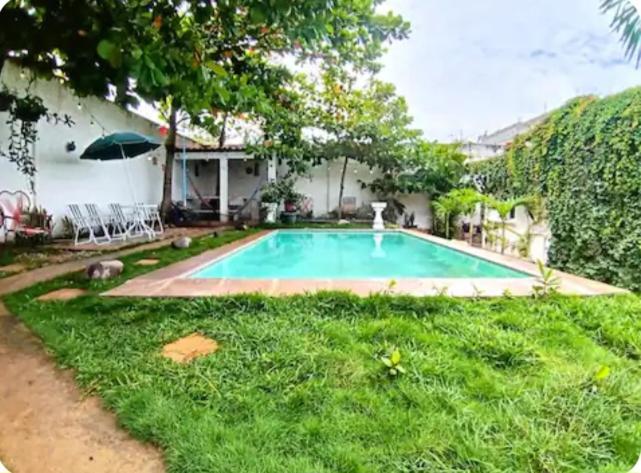 a swimming pool in the yard of a house at Casa chalet in Chiquimula