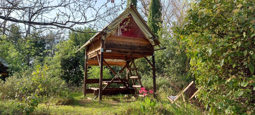 a tree house in the middle of a forest at Cabane Le Nid - CANAL DU MIDI in Carcassonne