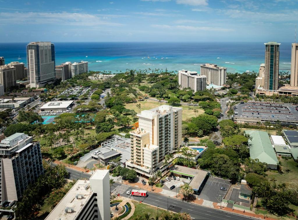 an aerial view of a city with the ocean at Luana Waikiki Hotel & Suites in Honolulu