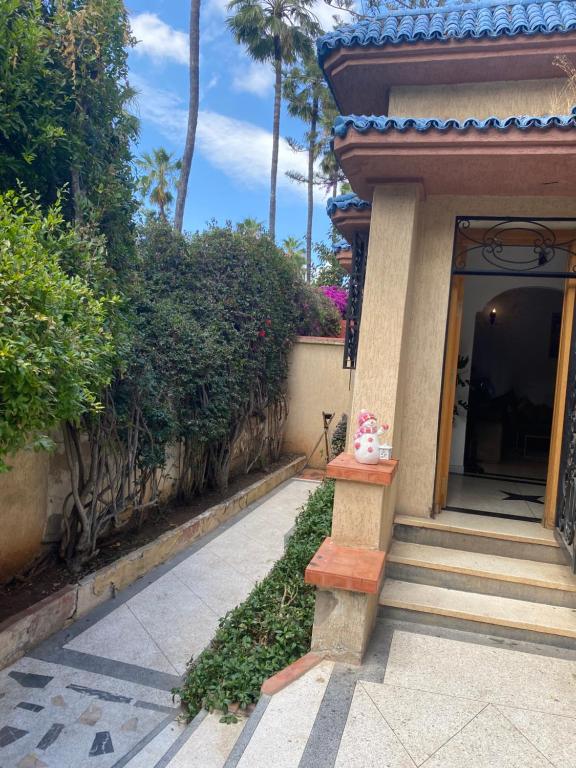 a building with a porch with a vase on the doorstep at Lux Villa in Casablanca