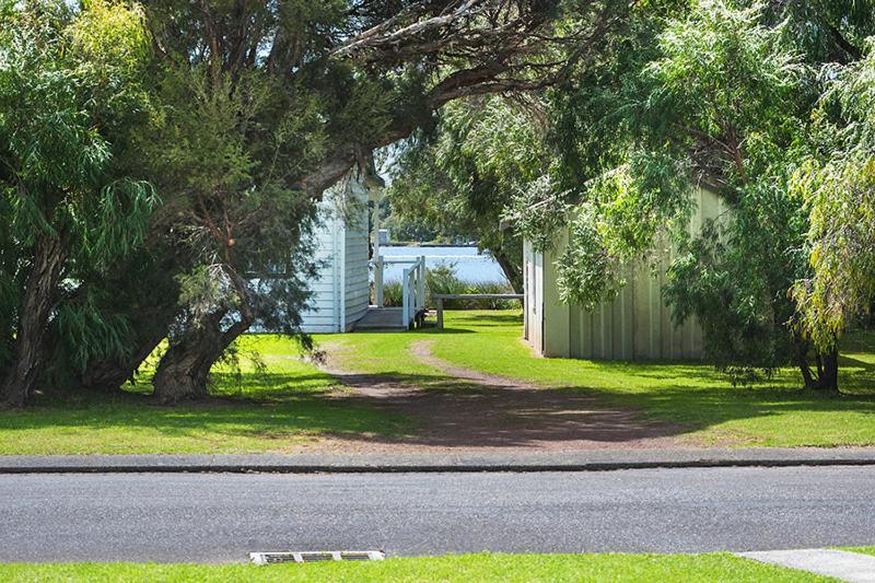 a house on the side of a street with a tree at Southerly Studio in Augusta