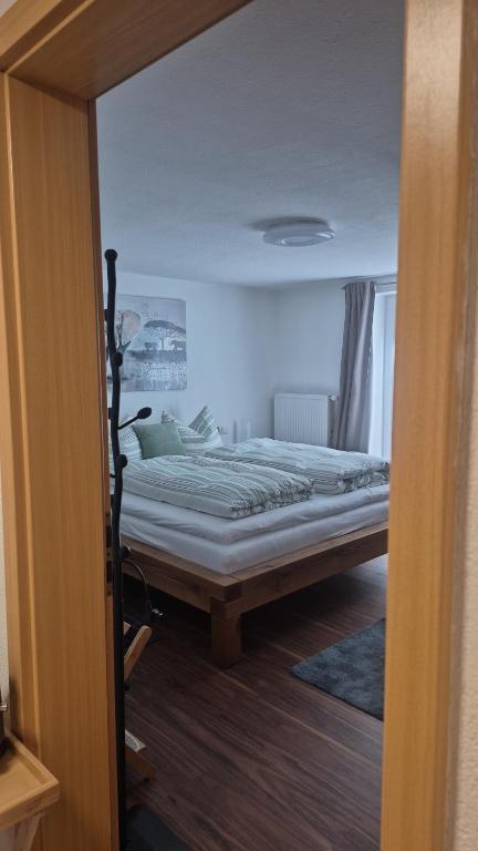 a bedroom with a bed in a room at i24rooms in Legau