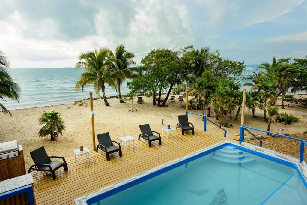 a view of the beach from a resort pool at Beachfront 3-Bed, 2-Bath Family Getaway with Pool in Placencia