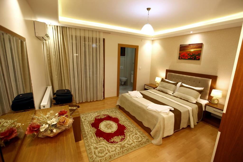 Postel nebo postele na pokoji v ubytování Ugur Termal Residence