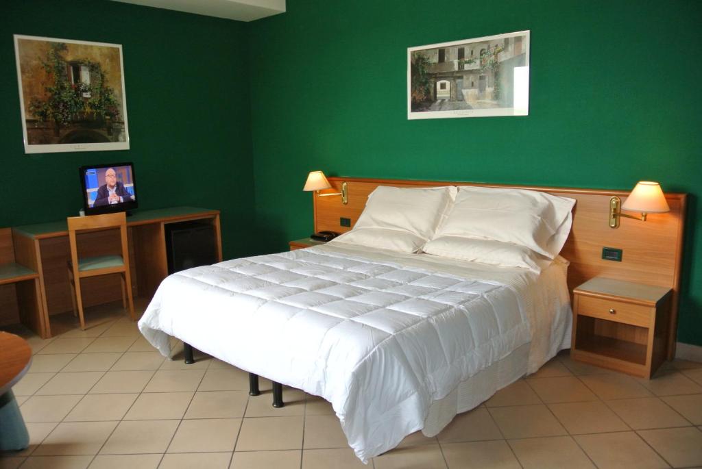 Postel nebo postele na pokoji v ubytování Modo Hotel