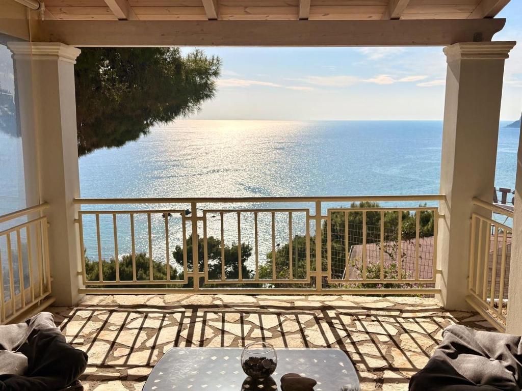 a view of the ocean from the balcony of a house at Vicky's Panoramic View Apartments in Pelekas