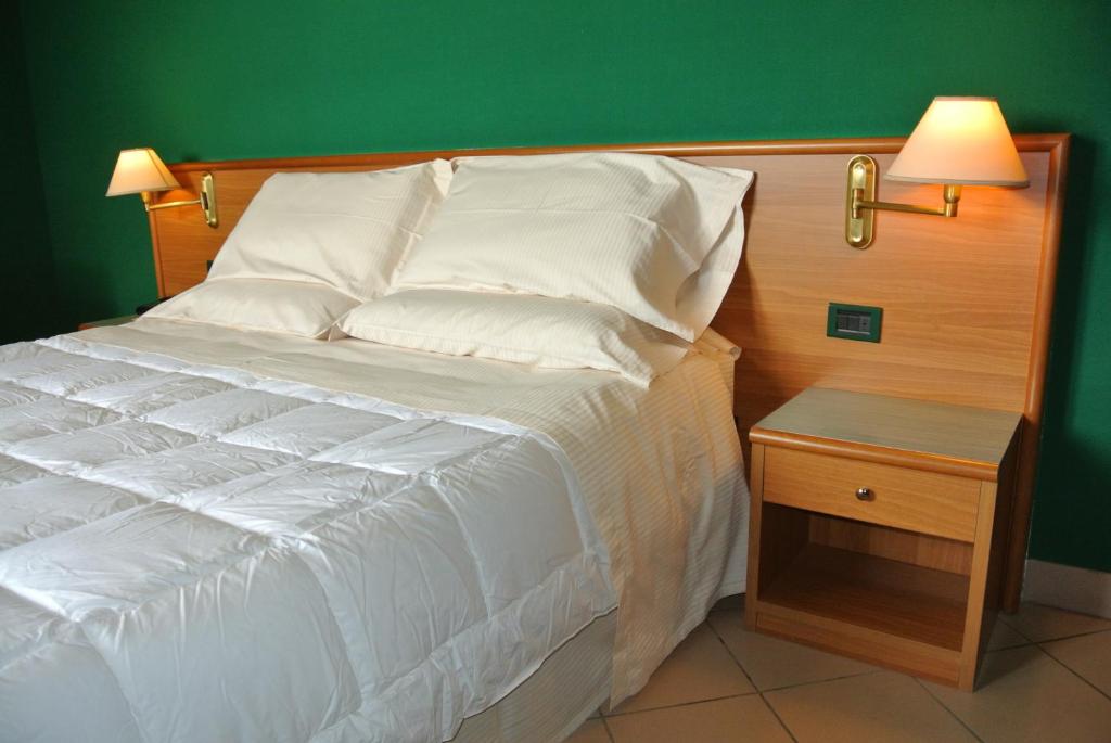 Postel nebo postele na pokoji v ubytování Modo Hotel