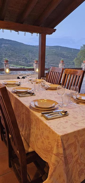 a table with glasses and plates on top of it at Cal Riol in Talarn