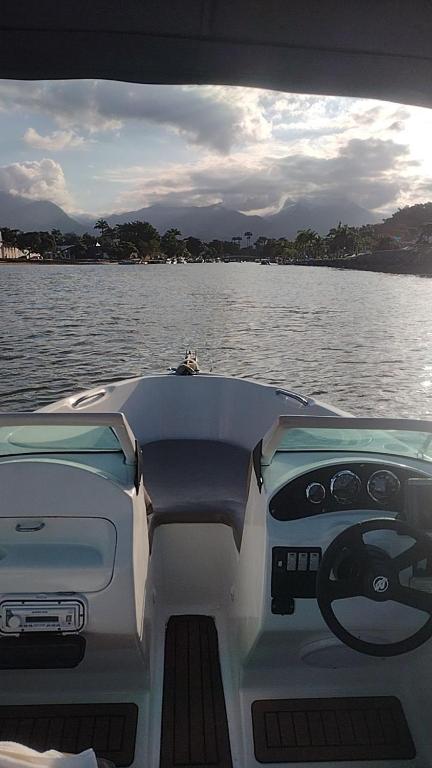 a boat on a body of water at Lancha melodia paraty in Paraty