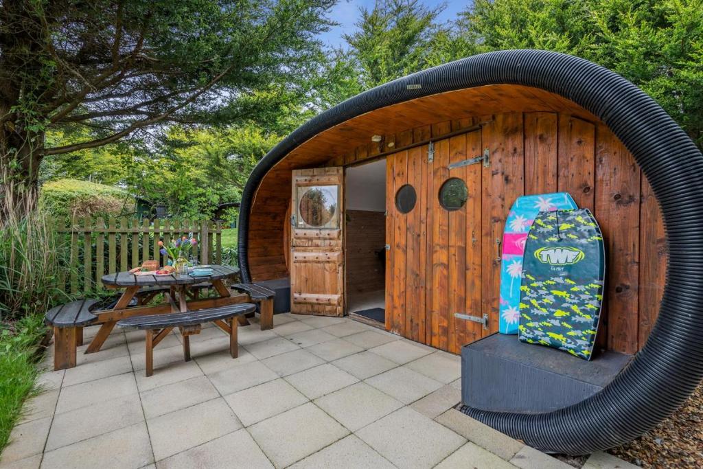 a gazebo with a table and a suitcase at 1 Bed in Bude oc-s34881 in Bude