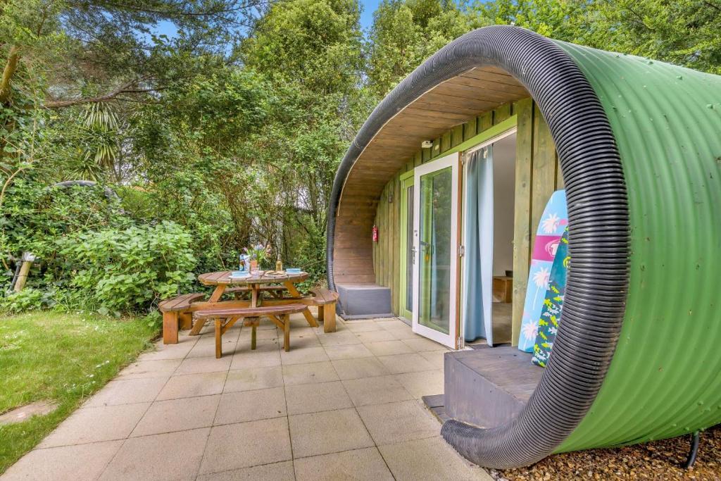 a house with a large inflatable arch over a patio at 1 Bed in Bude oc-s34858 in Bude