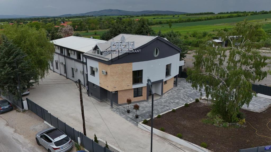 an aerial view of a house with a car parked in front at DION Hotel & Restaurant in Kumanovo