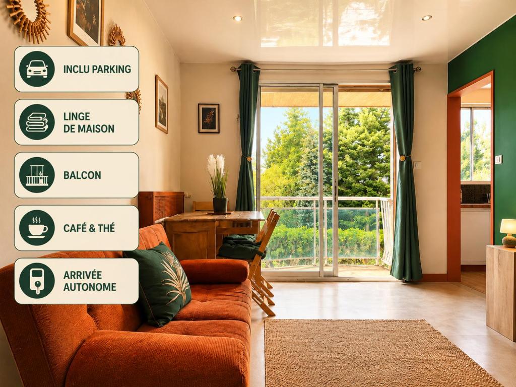 a living room with an orange couch and a sliding glass door at Appartement thème jungle in Avallon