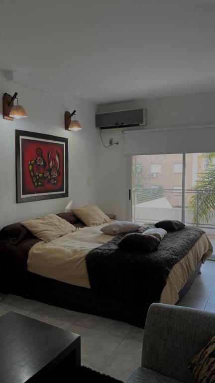 a bedroom with a large bed in a room at Mitre1349bis in Villa Basso