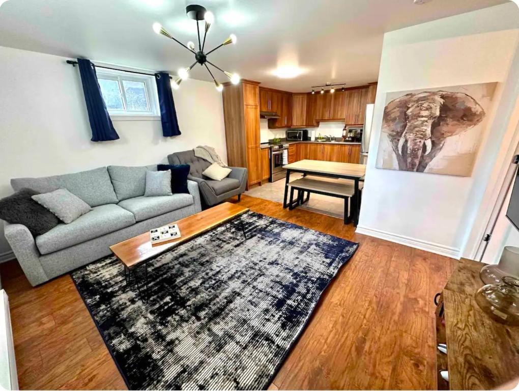 a living room with a couch and a table at The Extravagant Minimalist in Gatineau