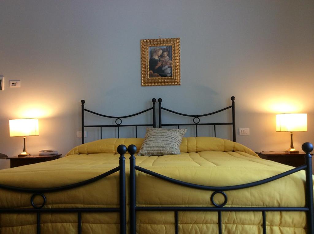 Postel nebo postele na pokoji v ubytování Relais Forti