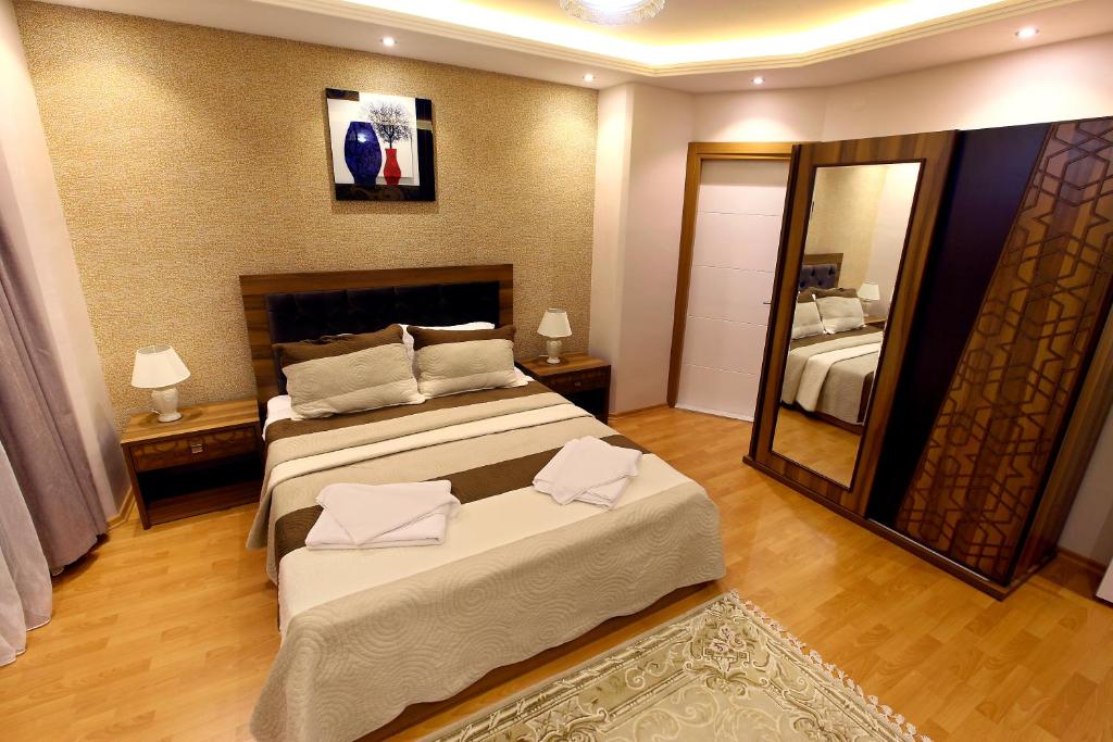 Postel nebo postele na pokoji v ubytování Ugur Termal Residence