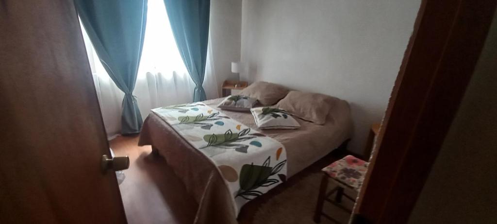 a small room with a bed and a couch at Cabañas Rapanui keka in Hanga Roa