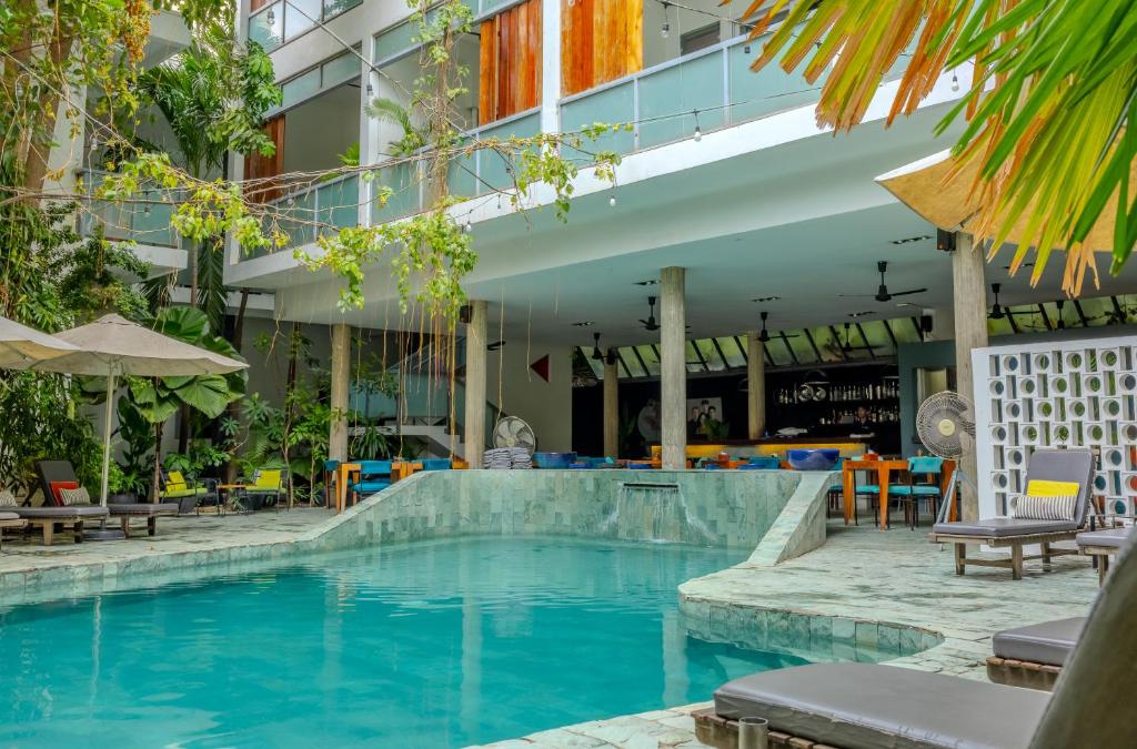 a swimming pool in the middle of a building at Sonitori Boutique Resort in Phnom Penh