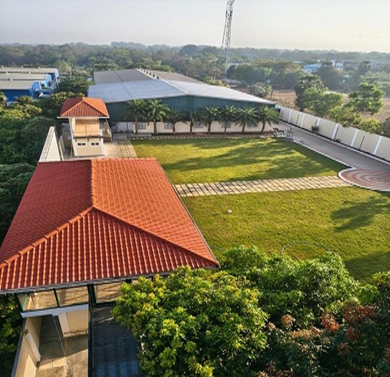 an overhead view of a building with an orange roof at Greenway Retreat Resort in Puducherry Airpoert
