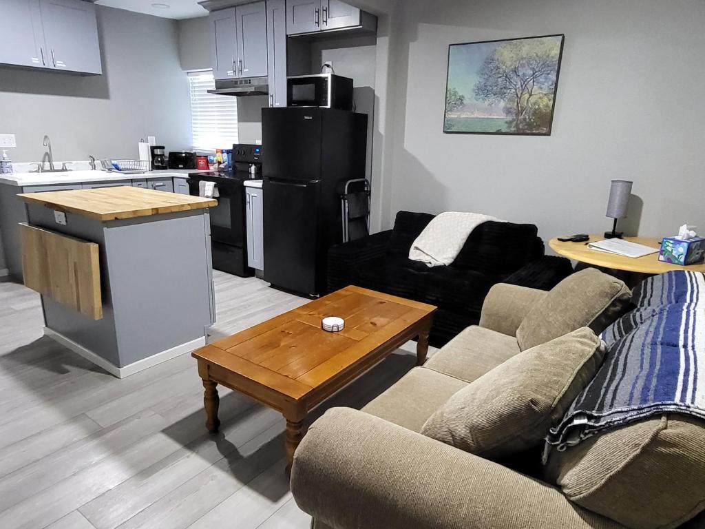 a living room with a couch and a table at Grove Street Couplet #2 in Baker City