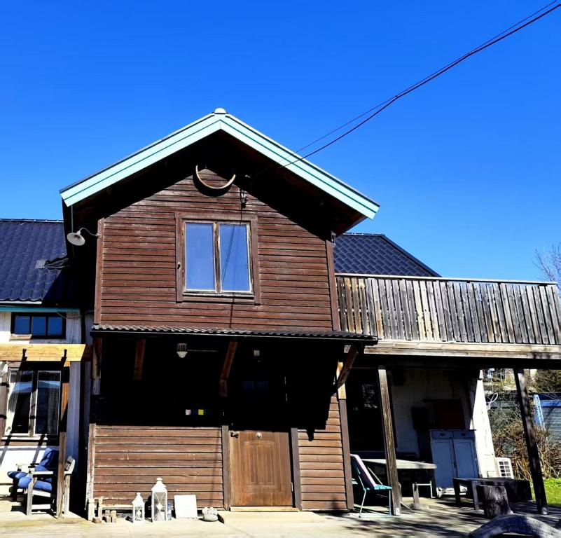 a wooden house with a window on top of it at Station Villa Vimmerby in Vimmerby