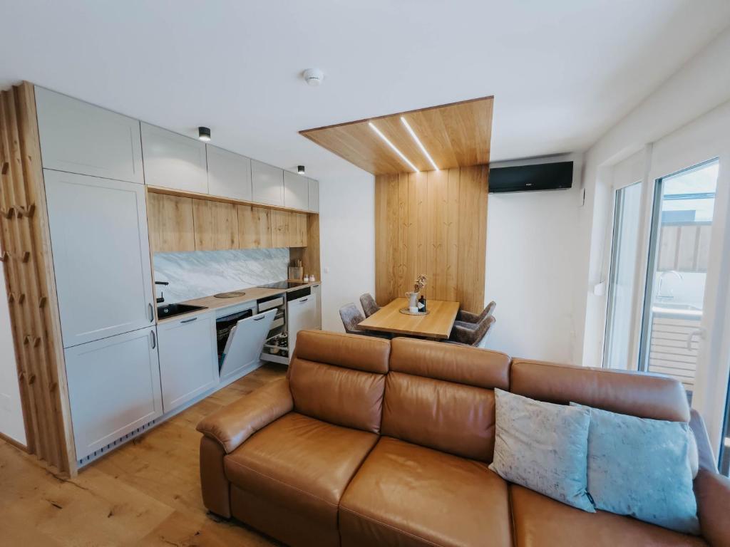 a living room with a couch and a table at Cozy Corner in Bovec