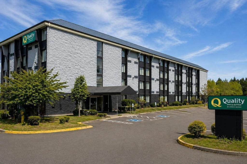 a large building with a sign in front of it at Quality Inn & Suites Everett in Everett