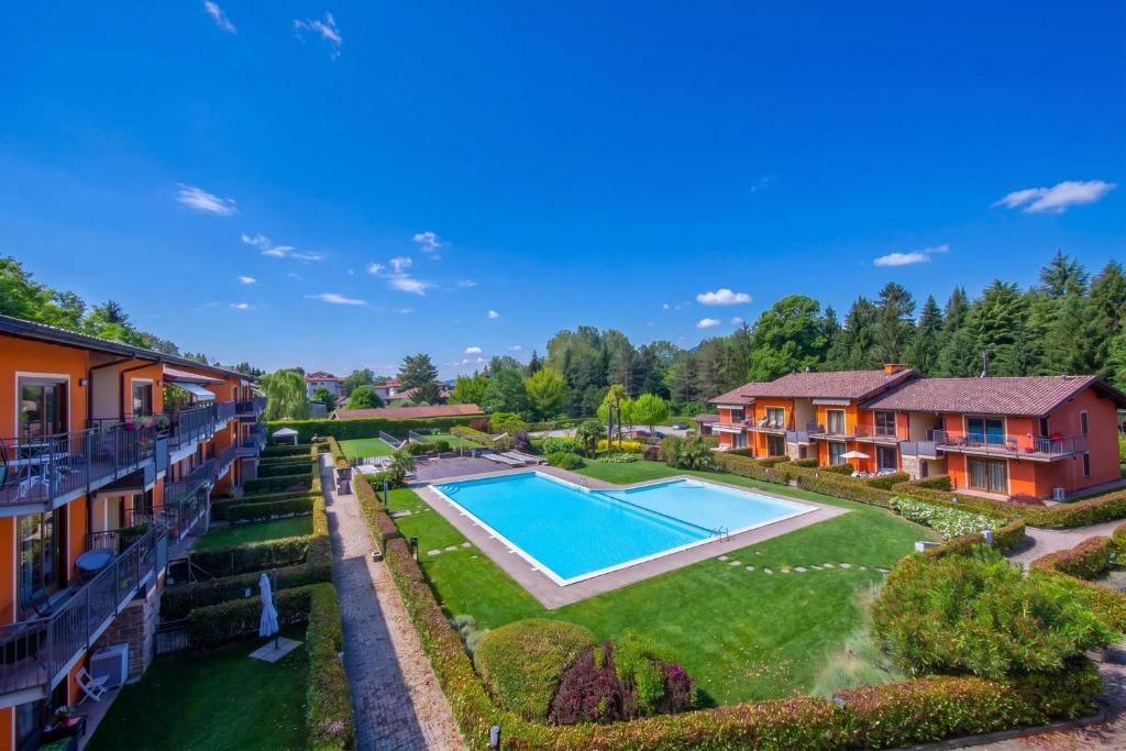 an aerial view of a house with a swimming pool at Lenni Apart. Swimming Pool and lake + WIFI - Happy Rentals in Leggiuno