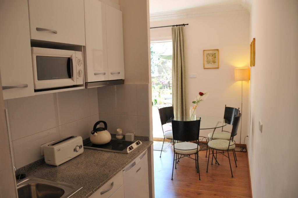 A kitchen or kitchenette at Tibidabo Apartments
