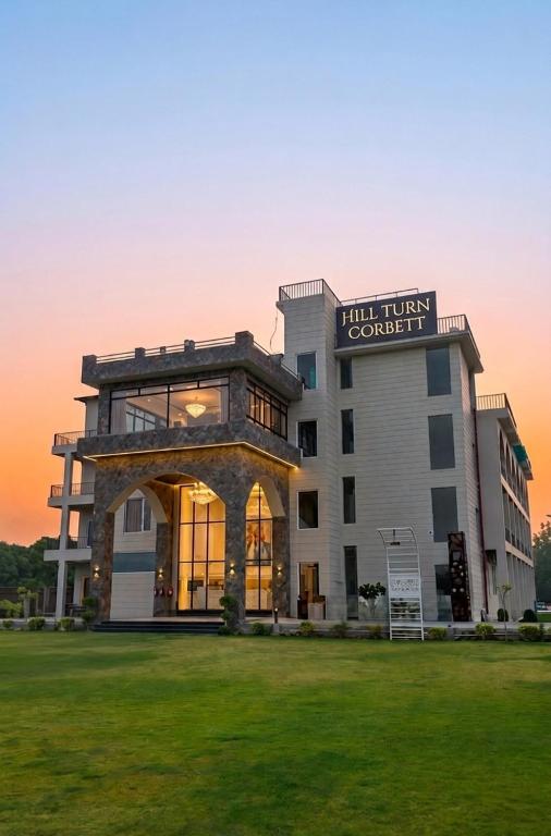a building with a sign that reads toll house court at Hill Turn Corbett in Rāmnagar
