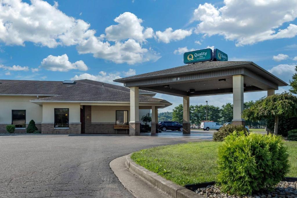 a gas station with a sign on top of it at Quality Inn Dover in Dover