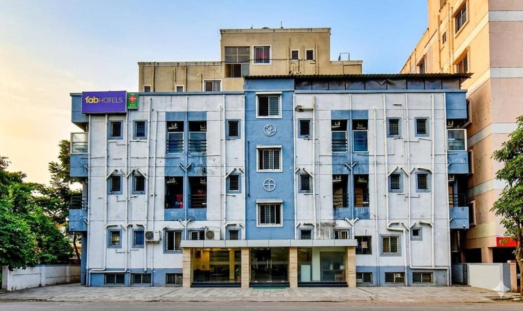 a building in the middle of two buildings at FabHotel SRH in Pune