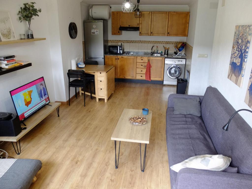a living room with a couch and a table at Apartamento Valdenieve VUTE-15-041 in Valdelinares