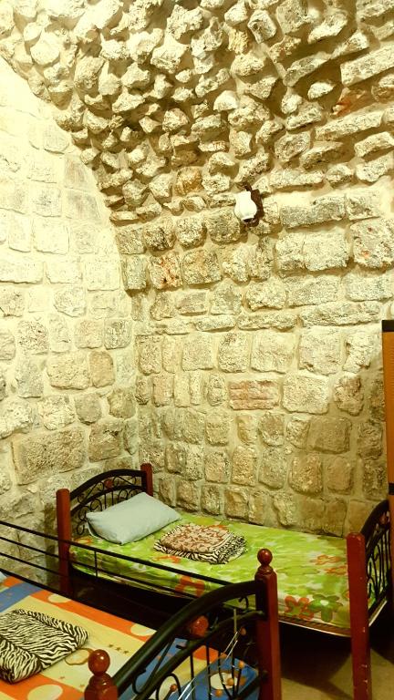 Voodi või voodid majutusasutuse Bab El-Silsileh Hostel toas