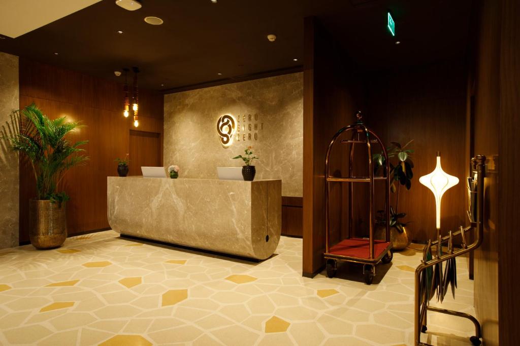 a bathroom with a tub and a sign on the wall at 080 Transit Hotel, T2 in Bangalore
