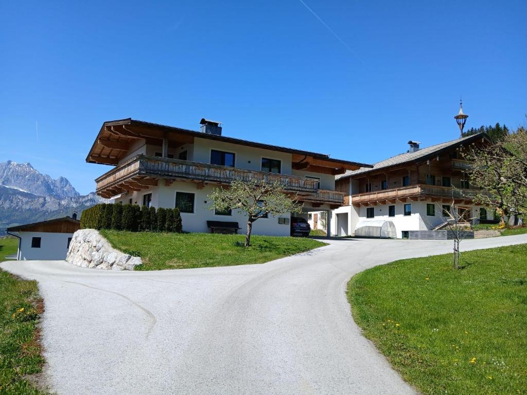 a winding road in front of a house at Sonnseit in Sankt Johann in Tirol