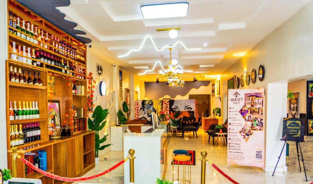 a room with a store with a counter and chairs at Akrafthaus by KAVKANZ in Abuja