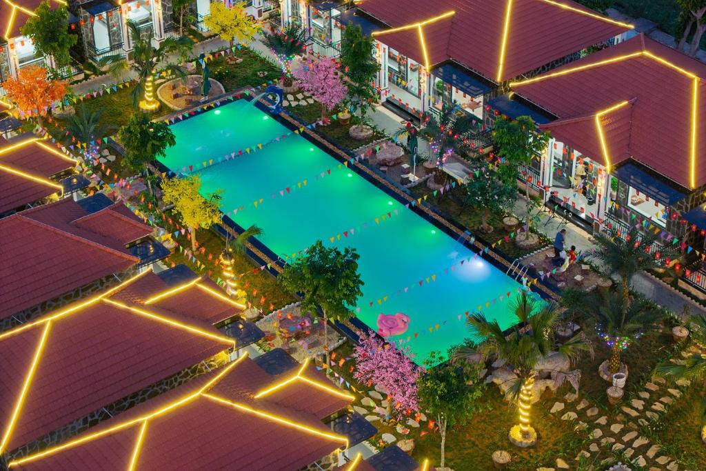 an overhead view of a swimming pool at night at Hoa Lư - An Resort in Ninh Binh