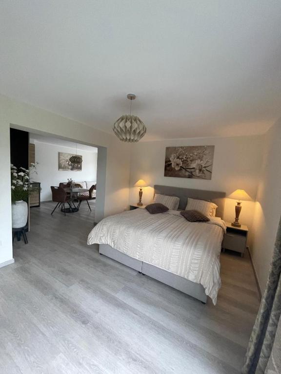 a bedroom with a bed and a dining room at Vakantie Studio Mari Jani in Waterlandkerkje