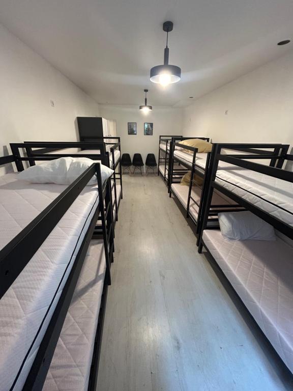 a room with four bunk beds in it with a hallway at Хостел Мануфактура in Kharkiv