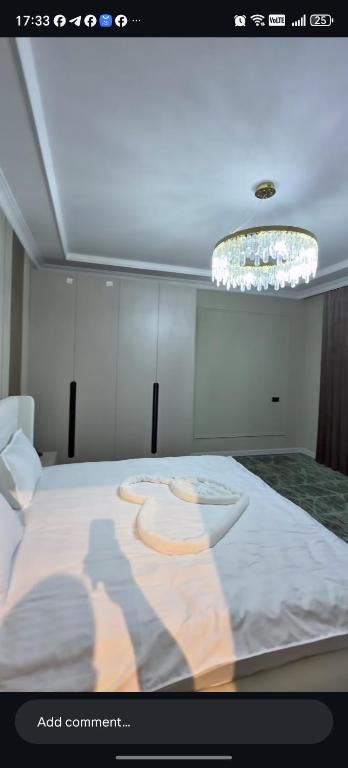 a picture of a bedroom with a large bed at AMARANT hotel in Baysun