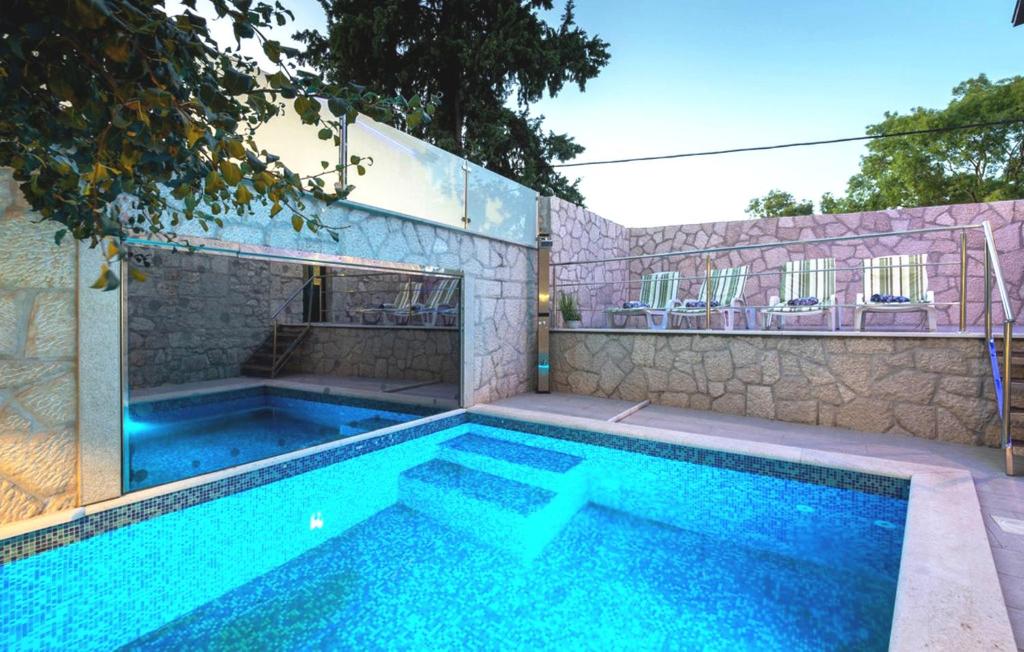 a swimming pool in a house at Stone house Lila Kamenmost Imotski in Kamenmost